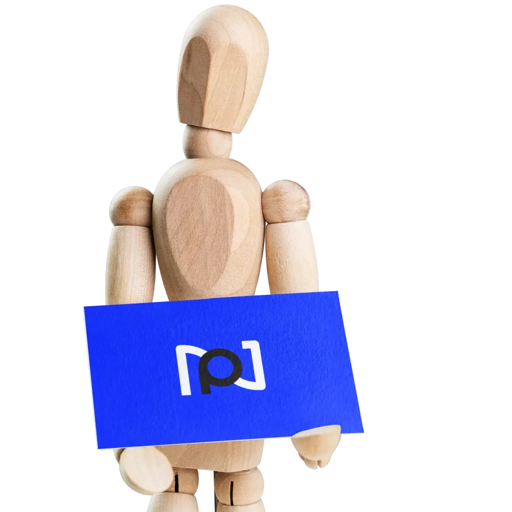 Wooden figure holding the new Nixpix UK Logo